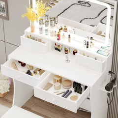 Escritorio de tocador LIKIMIO con espejo con luz LED, toma de corriente y 4 cajones, juego de mesa de maquillaje con taburete de almacenamiento y secador de pelo